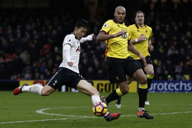 Tottenham Hotspur's Son Heung-Min (L) shoots but fails to score in the Premier League game