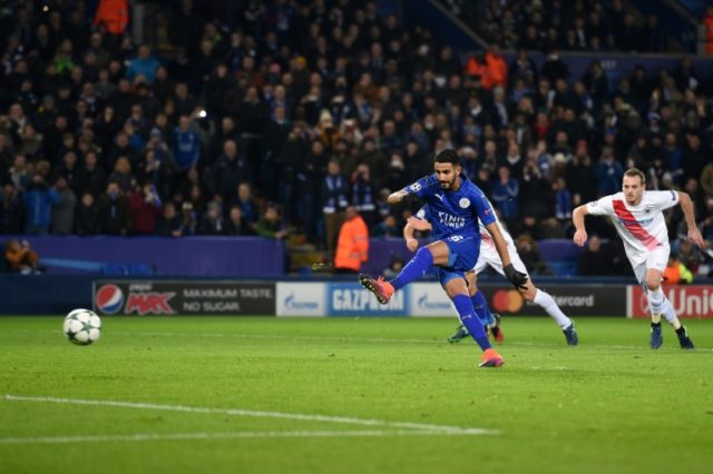 Leicester City's Algerian midfielder Riyad Mahrez shoots from the penalty spot to score hi