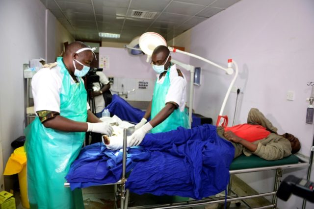 Kenyan Defence Force (KDF) doctors tend to an injured man at Kenyatta National Hospital in