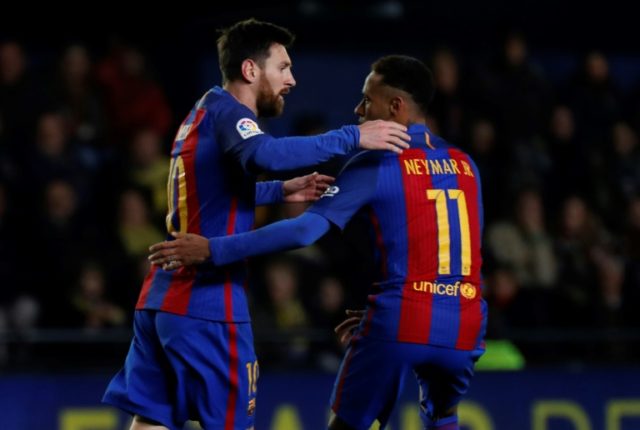 Barcelona's forward Lionel Messi (L) celebrates with Neymar after scoring on January 8, 20
