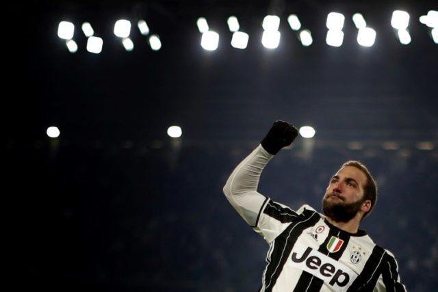 Juventus' forward Gonzalo Higuain celebrates after scoring against Bologna on January 8, 2