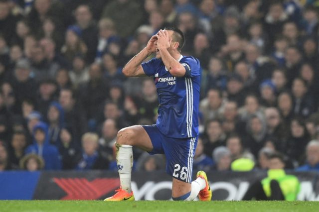 Chelsea's defender John Terry reacts after he is penalised for a challenge on Peterborough