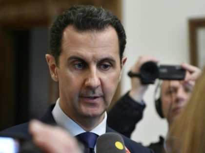 Syrian President Bashar al-Assad speaks to reporters on January 9, a day after after meeting with French lawmakers in Damascus