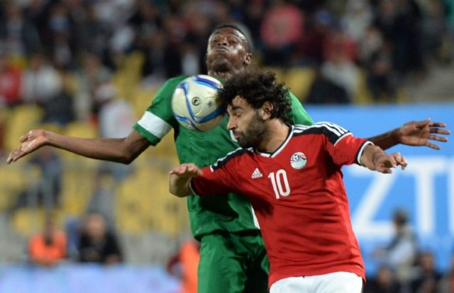 Egypt's Mohamed Saleh (front) and Nigeria's Stanley Amuzie fight for the ball during their