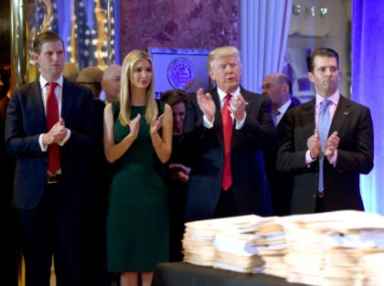 US President-elect Donald Trump along with his children (L-R) Eric, Ivanka and Donald Jr.