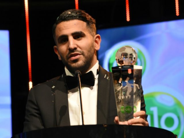 Algerian int'l and Leicester midfielder Riyad Mahrez holds the trophy after being crowned