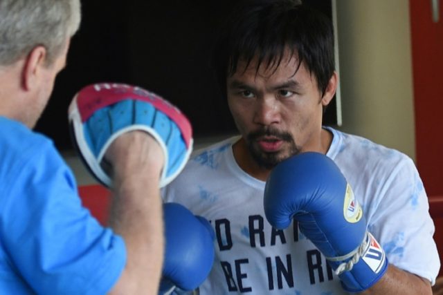 Philippine boxing legend Manny Pacquiao (right) trains at a gym in General Santos City in