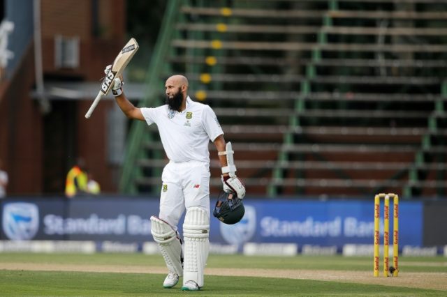 South Africa batsman Hashim Amla celebrates his century in his hundredth Test during the t