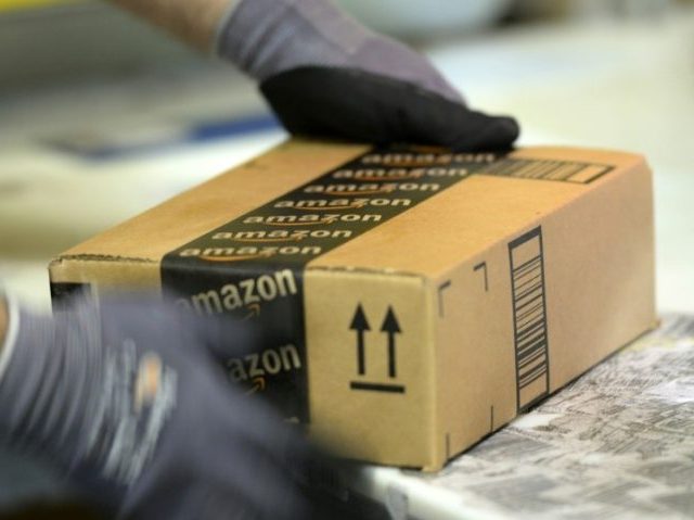 An employee prepares order at Amazon's San Bernardino Fulfillment Center