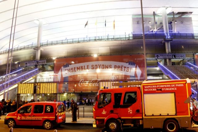 Emergency services vehicles arrive at the Stade de France in Saint Denis, suburban Paris o