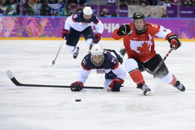 Hayley Wickenheiser (R) played 23 years on the Canadian women's national team and she spen