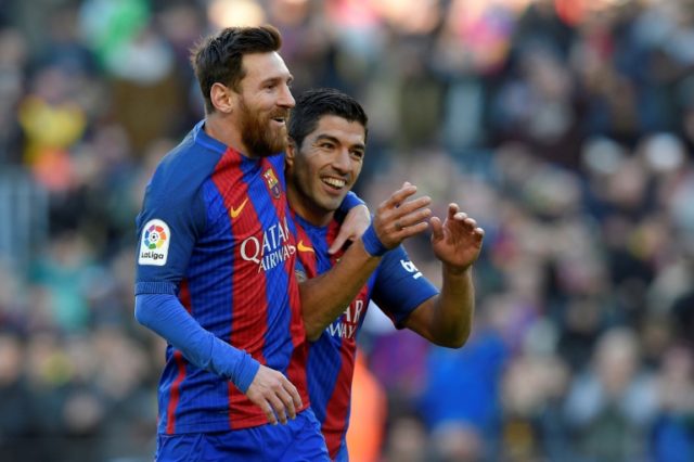 Barcelona's Luis Suarez celebrates with team-mate Lionel Messi after scoring against Las P
