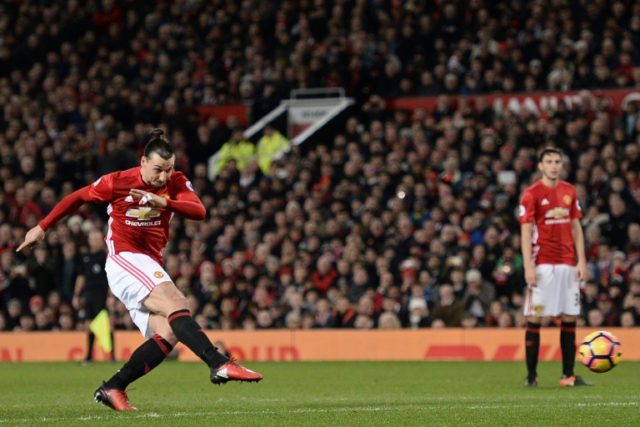 Manchester United's striker Zlatan Ibrahimovic (L) takes a free-kick during the English Pr