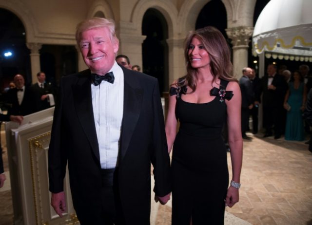 US President-elect Donald Trump arrives with his wife Melania for a New Year's Eve party at Mar-a-Lago in Palm Beach, Florida, on December 31, 2016