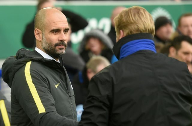 Manchester City manager Pep Guardiola (left) greets Everton boss Ronald Koeman ahead of th