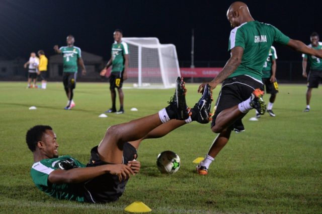 Ghana's Jordan Ayew and Andre Ayew (R) take part in a team training session in Port-Gentil