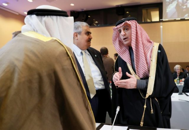 Saudi Foreign Minister Adel al-Jubeir (R) speaks with the Bahraini Foreign Minister Khalid