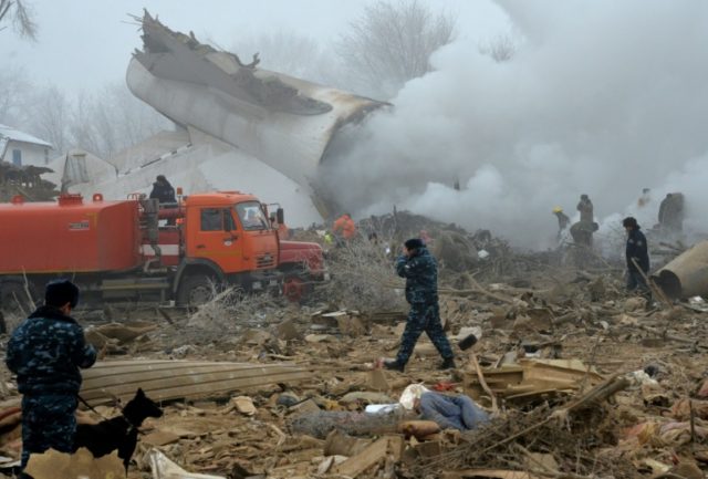 Rescue personnel work at the crash site of a Turkish cargo plane in the village of Dacha-S