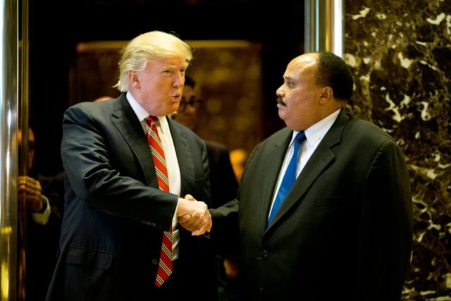 US President-elect Donald Trump shakes hands with Martin Luther King III after a meeting a