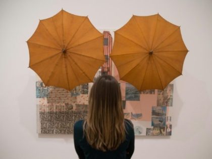 A woman looks at an art work entitled 'Untitled (Spread), 1983' by US artist Robert Rausch