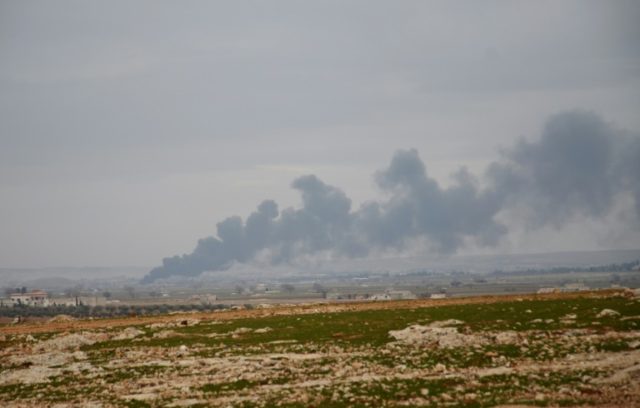 Smoke billows in the town of Qabasin, located northeast of the city of Al-Bab on January 8