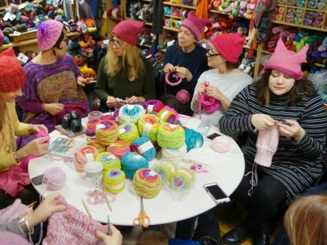 A group gathers at Knitty City in New York on January 17, 2017 to make pink Pussyhats in p