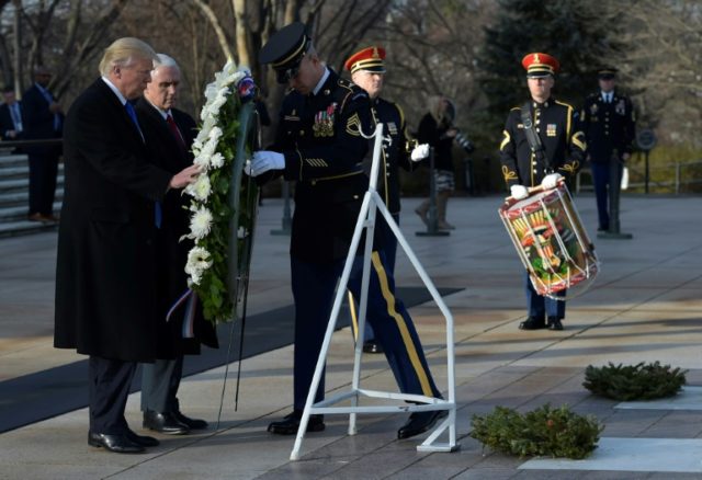 US President-elect Donald Trump and Vice President-elect Mike Pence take part in a wreath-