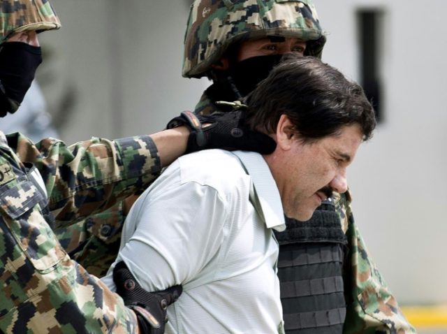 Mexican drug trafficker Joaquin Guzman Loera aka "el Chapo Guzman" escorted by marines in