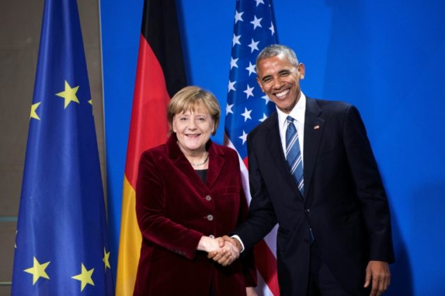 German Chancellor Angela Merkel and US President Barack Obama shake hands following a pres