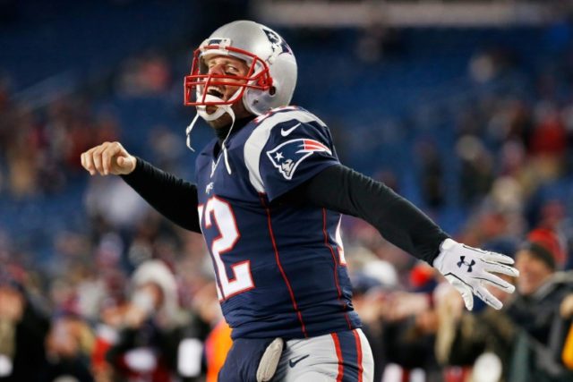 Tom Brady of the New England Patriots runs onto the field prior to the AFC Divisional Play