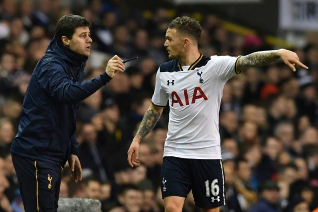 Tottenham Hotspur's manager Mauricio Pochettino gives instructions to defender Kieran Trip