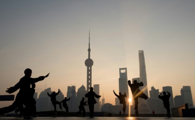 Morning exercises in front of the Lujiazui financial district in Shanghai