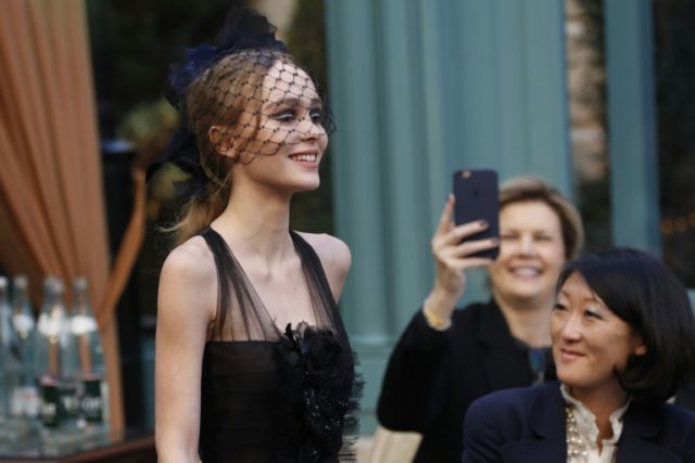 French-American actress and model Lily-Rose Depp presents a creation for Chanel, during th