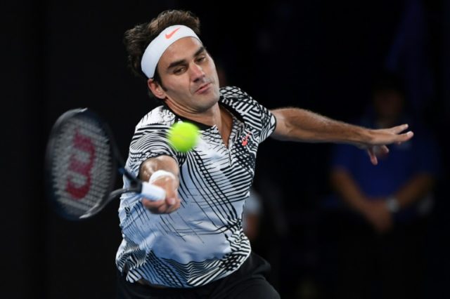 Switzerland's Roger Federer in action against the Czech Republic's Tomas Berdych in the Au