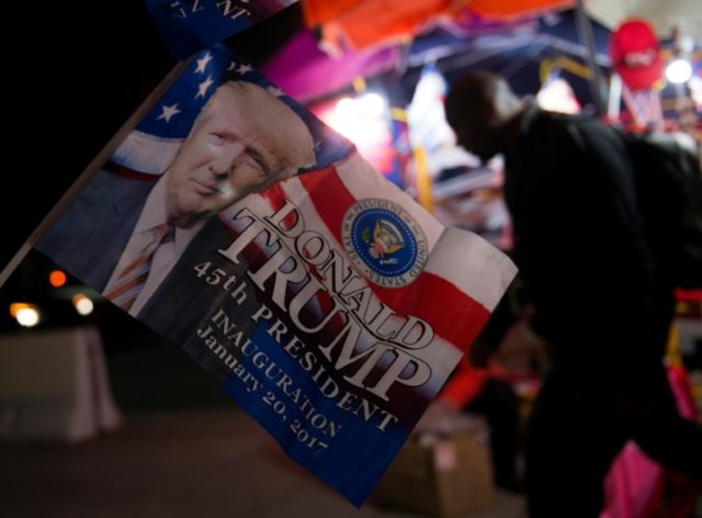 Vendors set up items to sell on the morning of Donald Trump's inauguration as the 45th Pre