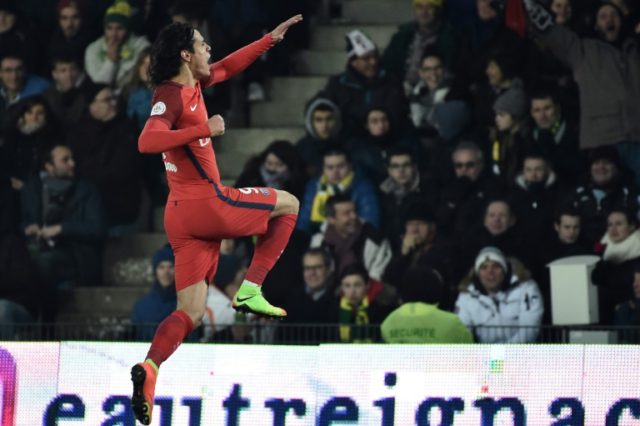 Paris Saint-Germain's forward Edinson Cavani celebrates after scoring a goal on January 21