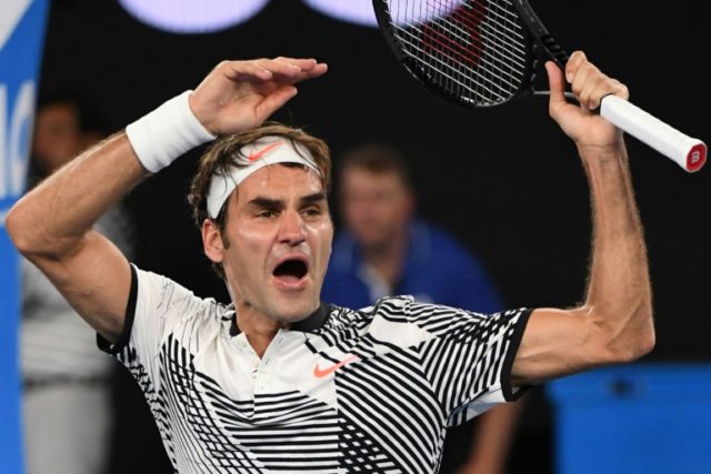Switzerland's Roger Federer celebrates his victory against Japan's Kei Nishikori after the