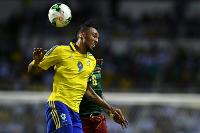 Gabon's forward Pierre-Emerick Aubameyang heads the ball with Cameroon's defender Ambroise