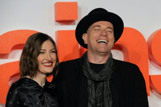 British actor Ewan McGregor (R) poses with British actress Kelly Macdonald (L) on the red