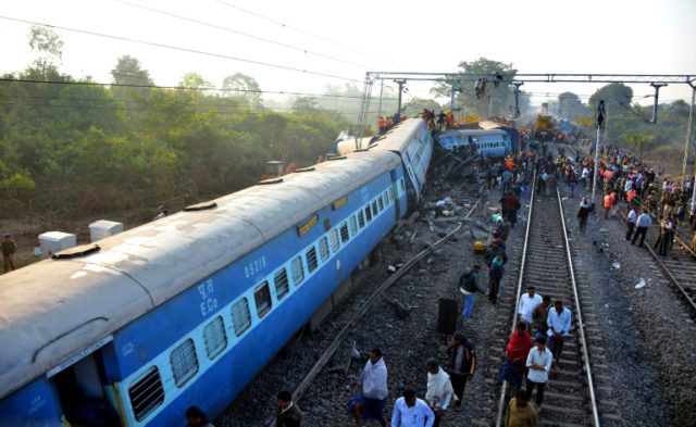 Rescue workers search for victims at the site of the derailment of the Jagdalpur-Bhubanesw