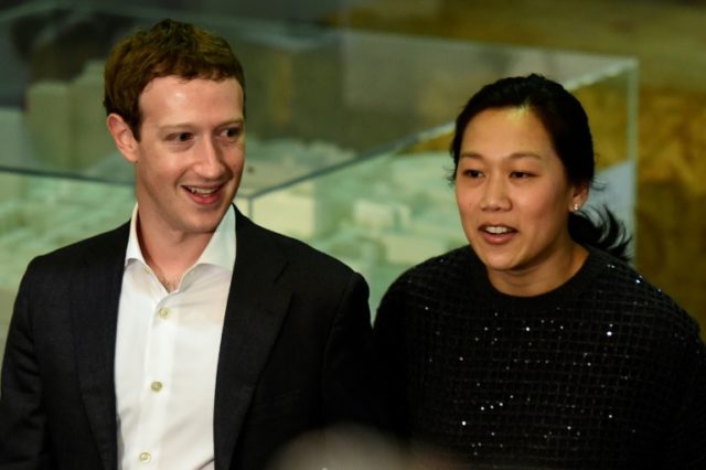 Facebook founder and CEO Mark Zuckerberg (L) and his wife Priscilla Chan pledged $3 billio