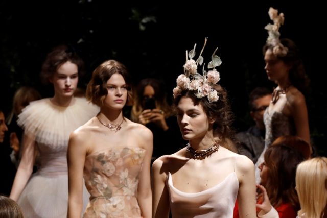 Models present creations for Christian Dior during the 2017 spring/summer Haute Couture co