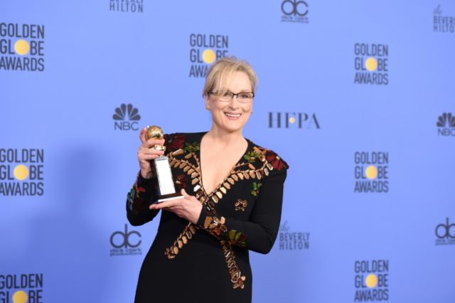 Actress Meryl Streep poses with The Cecil B. DeMille Award in the press room during the 74