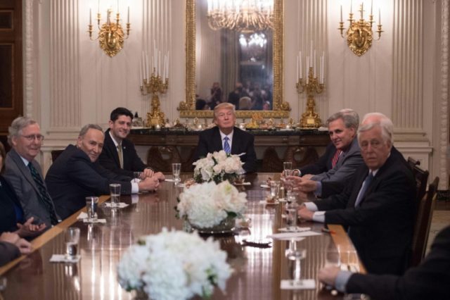 President Donald Trump smiles during a reception with Congressional leaders, including Sen