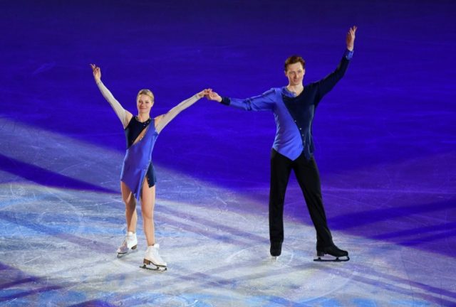 Russia's Evgenia Tarasova and Vladimir Morozov celebrate during the winner's ceremony of t