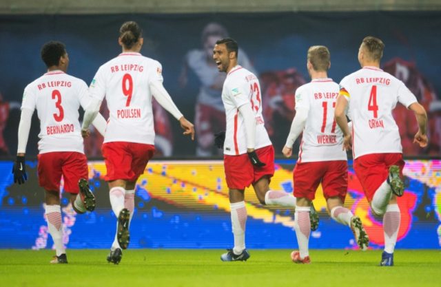 Leipzig's Marvin Compper (C) celebrates with teamates after scoring a goal during their Ge