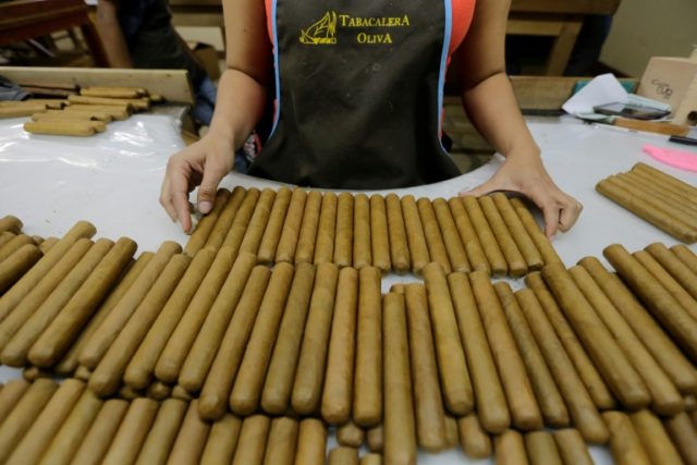 Cigar factories paying relatively high wages attract many workers, sometimes whole familie