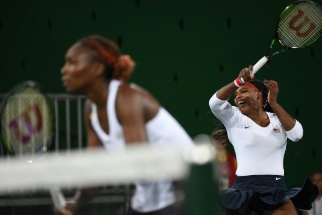USA's Serena Williams (R) and USA's Venus Williams return the ball to Czech Republic's Luc
