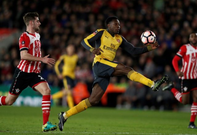 Arsenal's English striker Danny Welbeck (C) scores a goal during their English FA Cup 4th