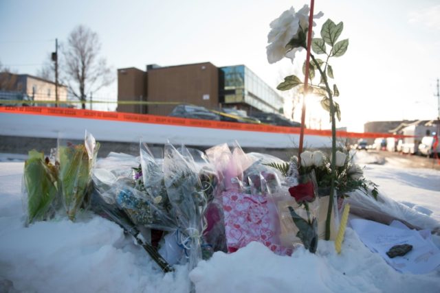Flowers at a makeshift memorial near the Islamic Cultural Center in Quebec City, Canada on